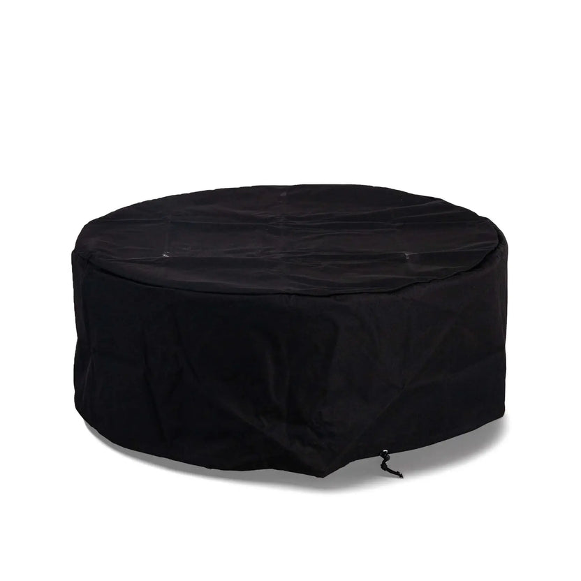 The Flame Havens Refuge Series 43-inch Round Natural Gas GFRC Concrete Fire Pit protected by its custom-fit black canvas fabric cover. Displayed on a white background, the weather-resistant cover fully encloses the fire pit with an integrated drawstring for a secure fit, helping protect the concrete finish and burner from outdoor elements when not in use.