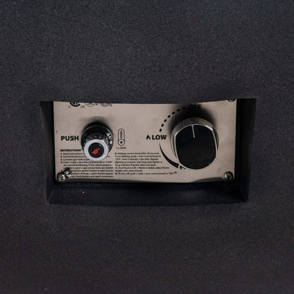 Close-up of the control panel on the Flame Havens Refuge Series 43-inch Round Natural Gas Black GFRC Concrete Fire Pit. The recessed stainless steel panel features the CSA-certified push-button ignition, flame control knob, and operating instructions, providing convenient and reliable ignition while preserving the fire pit's streamlined appearance.