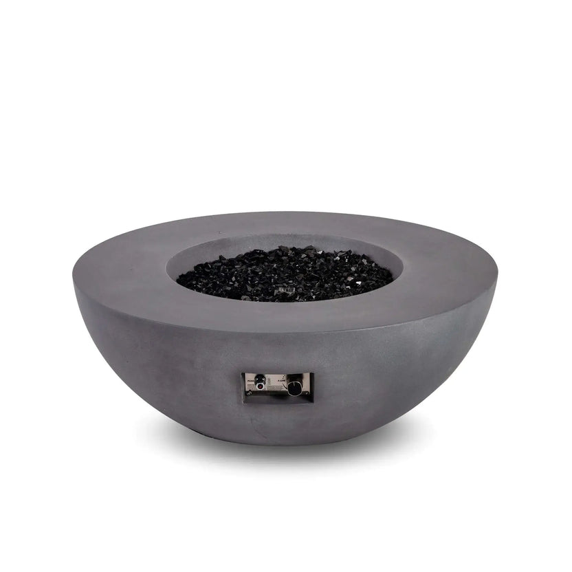 Front product image of the Flame Havens Refuge Series 43-inch Round Natural Gas Gray GFRC Concrete Fire Pit filled with reflective tempered black fire glass. The burner is off, allowing a clear view of the recessed fire media and the integrated front control panel with electronic ignition and flame adjustment controls.
