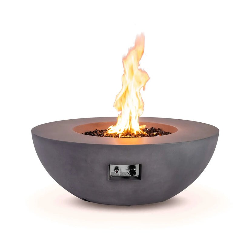 Front product image of the Flame Havens Refuge Series 43-inch Round Natural Gas Gray GFRC Concrete Fire Pit burning with a vibrant natural gas flame above reflective tempered black fire glass. The recessed stainless steel control panel with electronic ignition and flame adjustment is visible, highlighting the premium craftsmanship and modern round fire pit design.