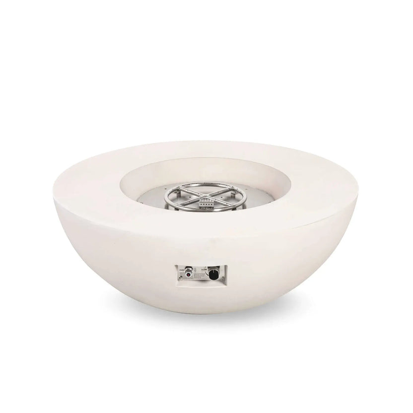 Studio image of the Flame Havens Refuge Series 43-inch Round Natural Gas White GFRC Concrete Fire Pit with the reflective fire glass removed, revealing the stainless steel burner ring, burner pan, and CSA-certified ignition assembly. The exposed components showcase the durable construction and professional-grade burner system.