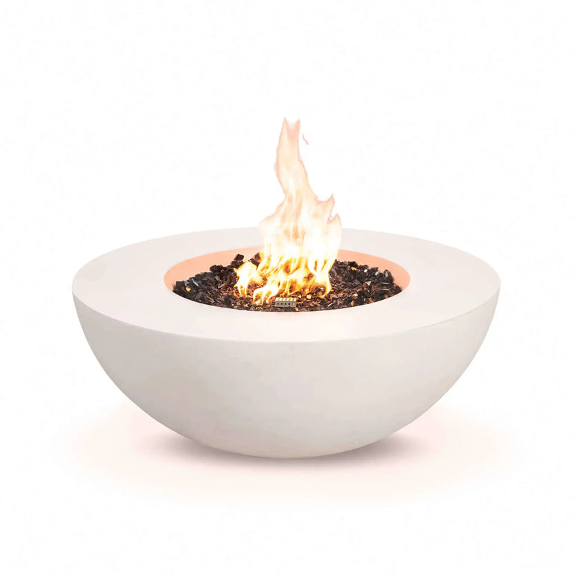Front studio image of the Flame Havens Refuge Series 43-inch Round Natural Gas White GFRC Concrete Fire Pit burning with bright natural gas flames over reflective tempered black fire glass. The clean design features a concealed control configuration, allowing the modern white concrete fire pit and vibrant flame pattern to take center stage.