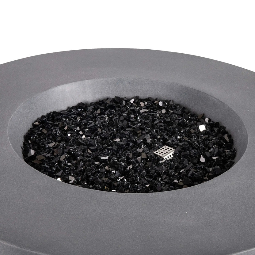 Close-up of the Flame Havens Refuge Series 43-inch Round Propane Gas GFRC Concrete Fire Pit in Gray, showcasing premium black reflective fire glass evenly covering the stainless steel burner system. The image highlights the smooth GFRC concrete finish, recessed burner area, and elegant fire media that enhances the fire pit's modern outdoor design.