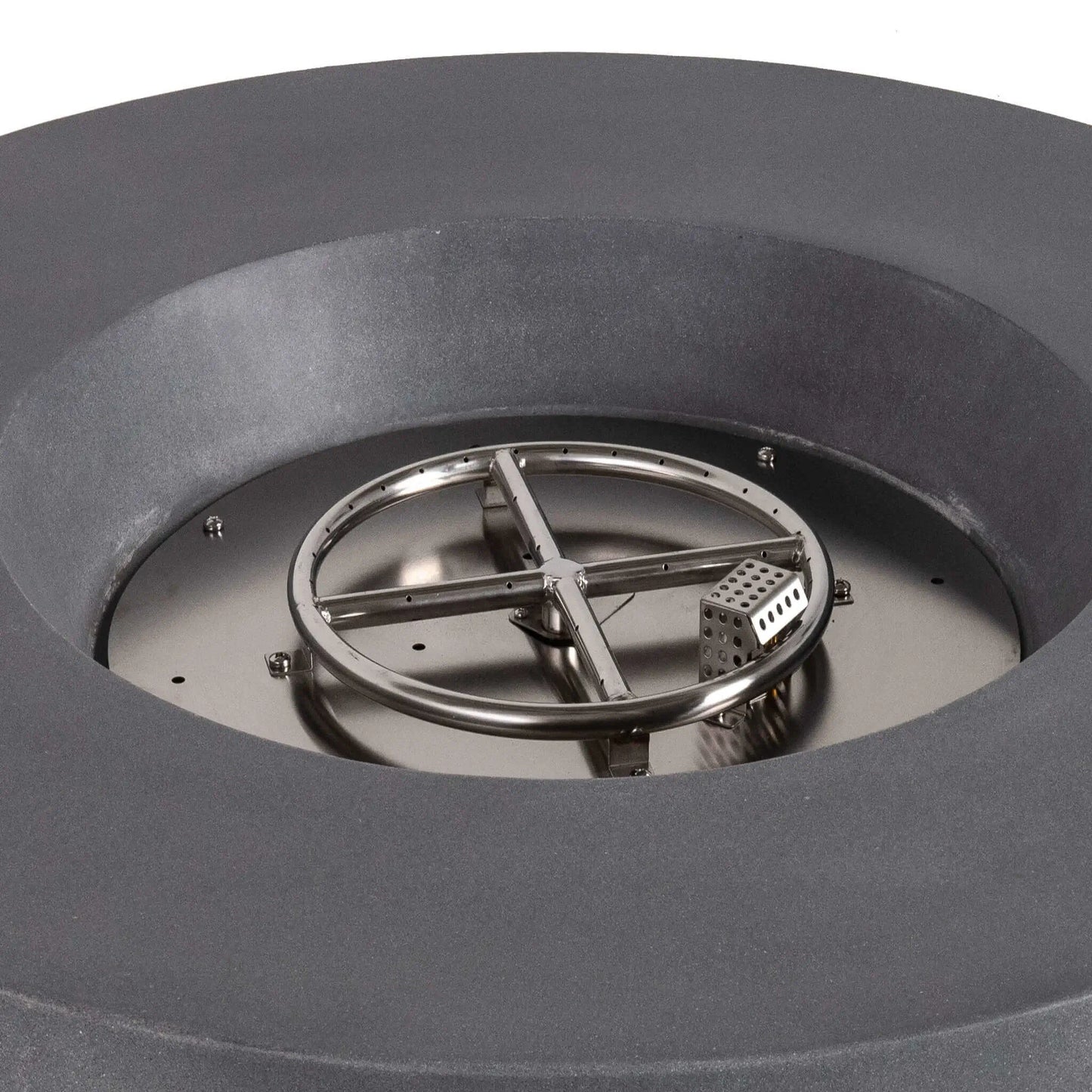Close-up of the stainless steel circular burner and integrated CSA-certified ignition system inside the Flame Havens Refuge Series 43-inch Round Propane Gas GFRC Concrete Fire Pit in Gray. The image showcases the precision burner ring, ignition cage, and premium stainless steel components before black reflective fire glass is installed.