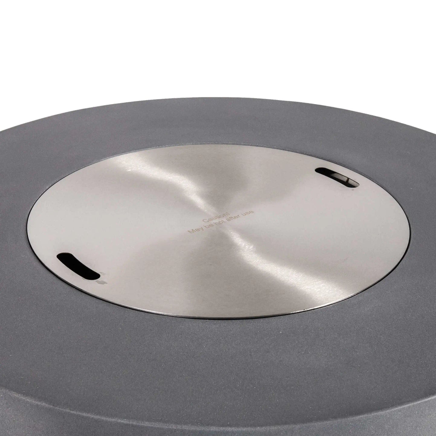 The Flame Havens Refuge Series 43-inch Round Propane Gas GFRC Concrete Fire Pit in Gray featuring the optional stainless steel burner cover installed flush within the burner opening. The brushed stainless steel cover creates a clean tabletop surface while protecting the burner system when the fire pit is not in use, complementing the modern GFRC concrete design.