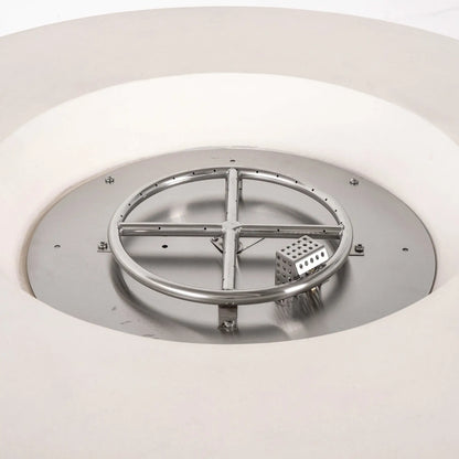Close-up of the stainless steel burner assembly and CSA-certified ignition system inside the Flame Havens Refuge Series 43-inch Round Propane Gas GFRC Concrete Fire Pit in White. The image showcases the precision burner ring, ignition housing, and stainless burner pan designed for reliable performance and even flame distribution.