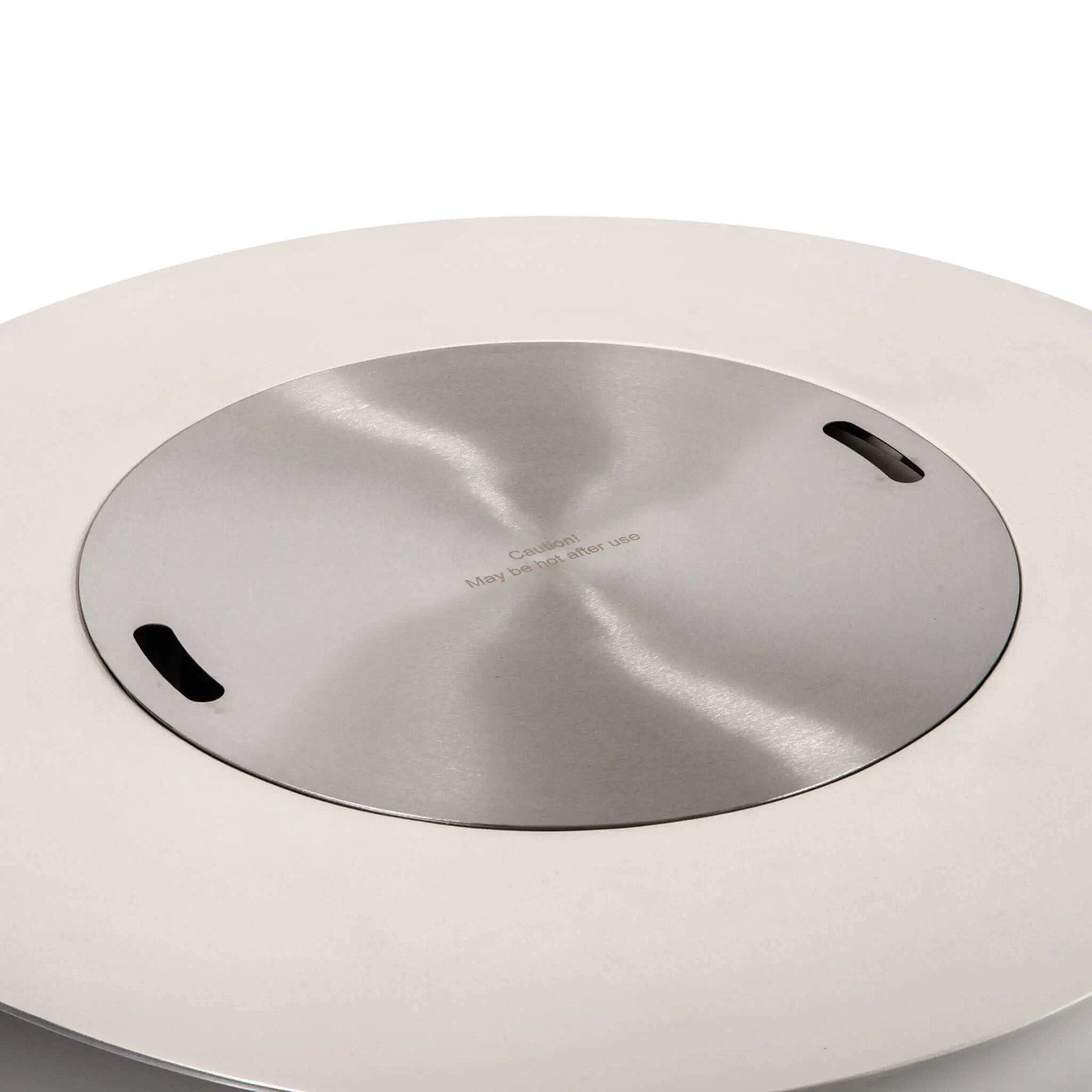 The Flame Havens Refuge Series 43-inch Round Propane Gas GFRC Concrete Fire Pit in White fitted with the optional brushed stainless steel burner cover. The cover sits flush within the burner opening, transforming the fire pit into a stylish outdoor table while preserving the clean lines and premium GFRC concrete construction.