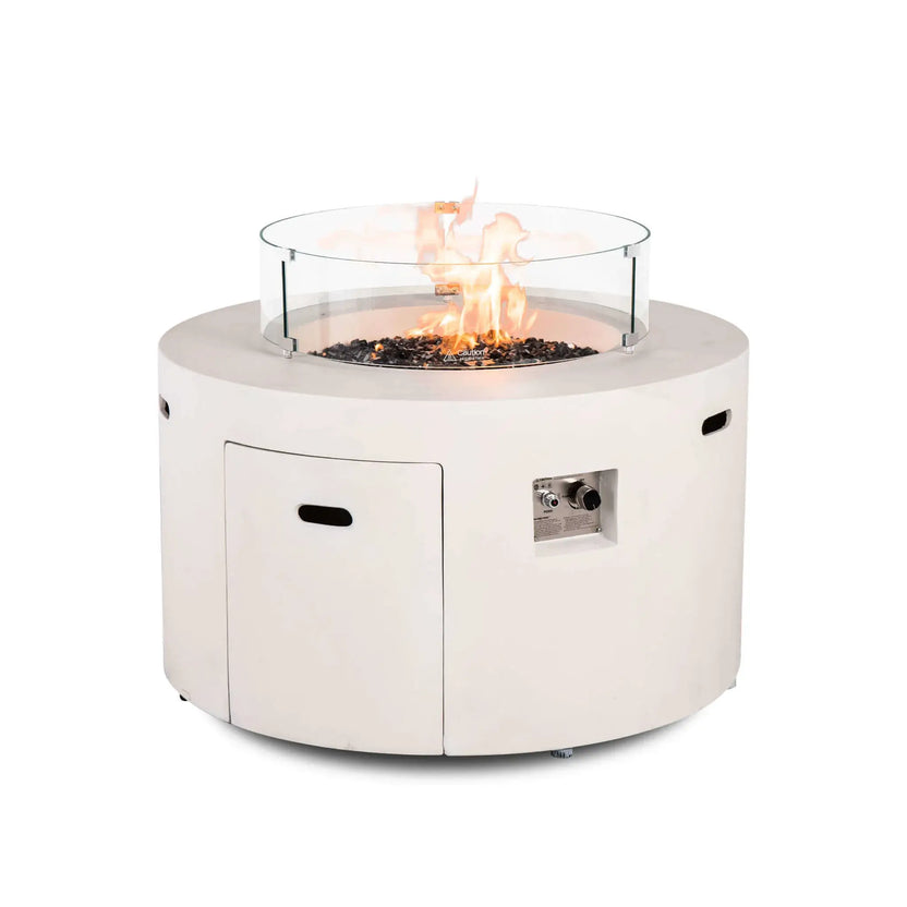 The Flame Havens Refuge Series 43-inch Round Propane Gas GFRC Concrete Fire Pit in White operating with premium tempered black reflective fire glass and the optional tempered glass wind guard installed. The image highlights the protective clear glass barrier, steady flame pattern, and contemporary round fire pit design for upscale outdoor spaces.