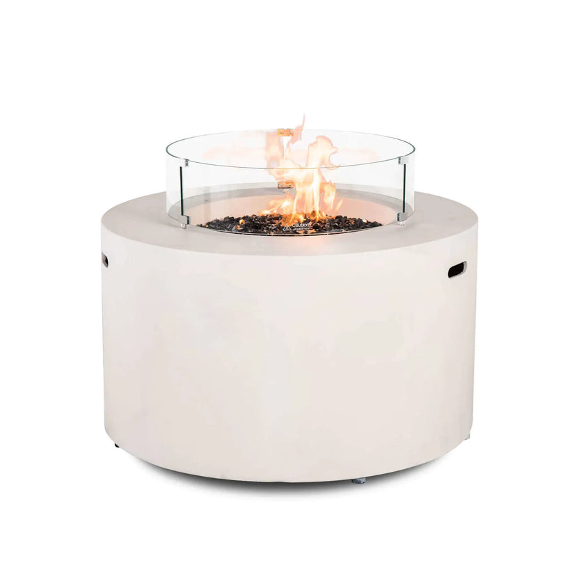 Front product image of the Flame Havens Refuge Series 43-inch Round Propane Gas GFRC Concrete Fire Pit in White operating with premium tempered black reflective fire glass and the optional tempered glass wind guard installed. The clean white GFRC concrete body, vibrant flame, and crystal-clear circular wind guard showcase a premium outdoor fire pit designed for luxury patios and backyard entertaining.