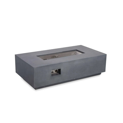 Angled product view of the Flame Havens Refuge Series 56 x 30 x 15 inch rectangle natural gas gray GFRC concrete fire pit with the reflective tempered black fire glass removed, exposing the stainless steel burner pan, linear burner, and CSA-certified ignition system for installation and maintenance visibility.