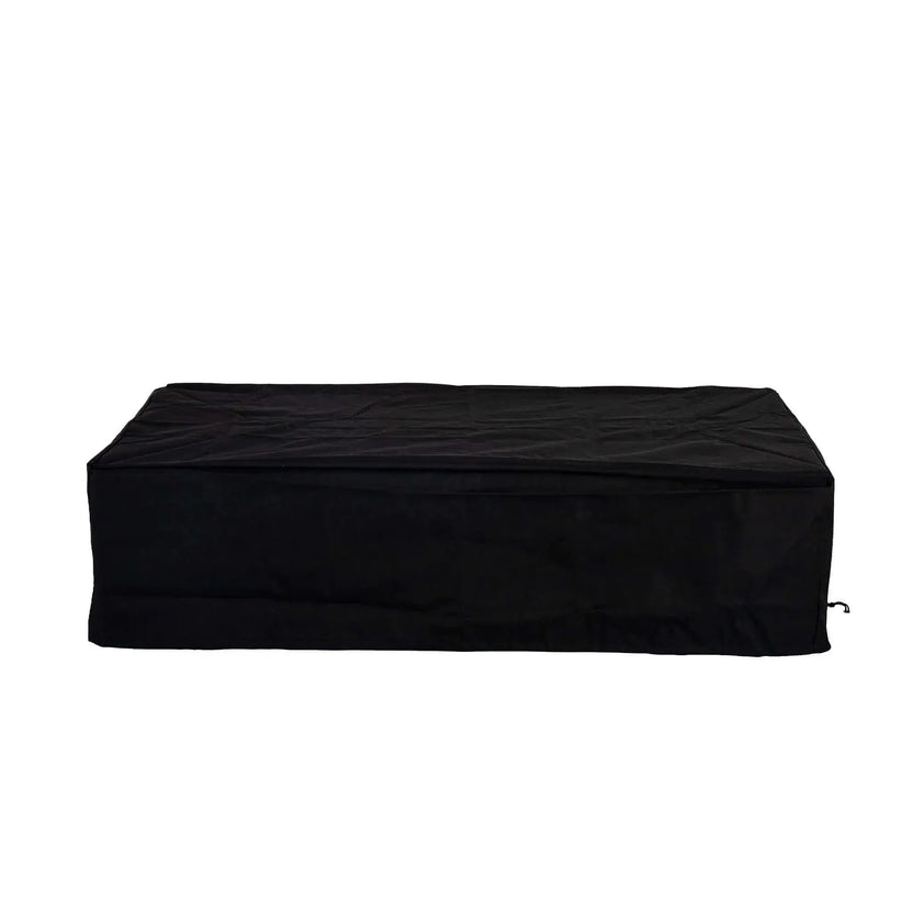 Straight-on product image of the Flame Havens Refuge Series 56 x 30 x 15 inch rectangle natural gas GFRC fire pit protected by a fitted black canvas fabric cover, designed to shield the fire feature from outdoor weather while maintaining a clean appearance.