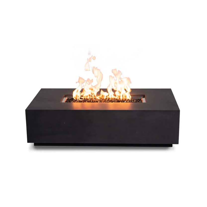Straight-on product view of the Flame Havens Refuge Series 56 x 30 x 15 inch rectangle natural gas GFRC concrete fire pit in black, burning with bright flames over reflective tempered black fire glass. The clean front profile features no visible controls, emphasizing the minimalist, contemporary design.