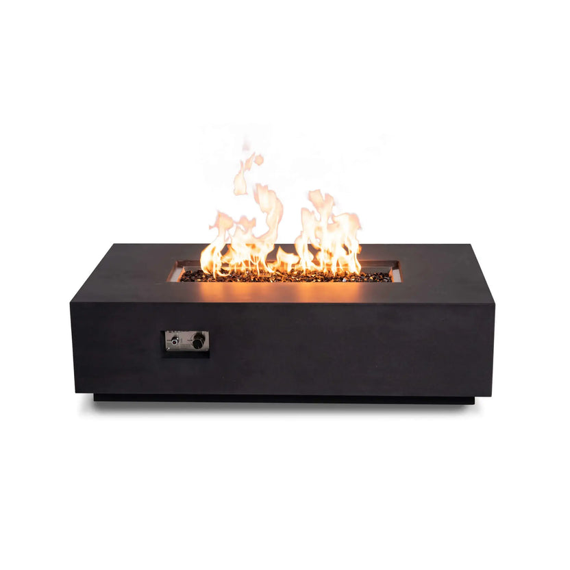traight-on view of the Flame Havens Refuge Series 56 x 30 x 15 inch rectangle natural gas GFRC concrete fire pit in black, featuring reflective tempered black fire glass, vibrant flames, and the recessed front control panel for convenient ignition and flame adjustment.