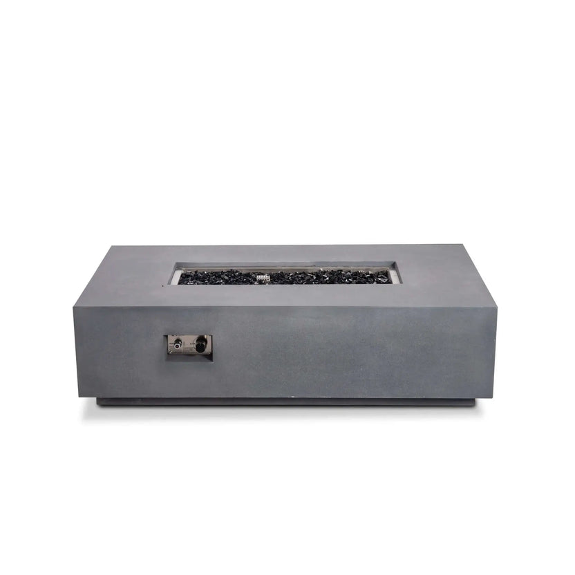 Straight-on product image of the Flame Havens Refuge Series 56 x 30 x 15 inch rectangle natural gas gray GFRC fire pit filled with reflective tempered black fire glass. The recessed stainless steel control panel is visible while the fire feature is turned off, emphasizing its modern, minimalist appearance.