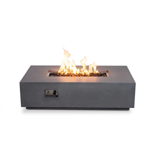 Straight front view of the Flame Havens Refuge Series 56 x 30 x 15 inch rectangle natural gas gray GFRC fire pit burning over reflective tempered black fire glass. The recessed stainless steel control panel is visible on the front, highlighting the integrated ignition system while emphasizing the fire pit's clean, low-profile contemporary design.