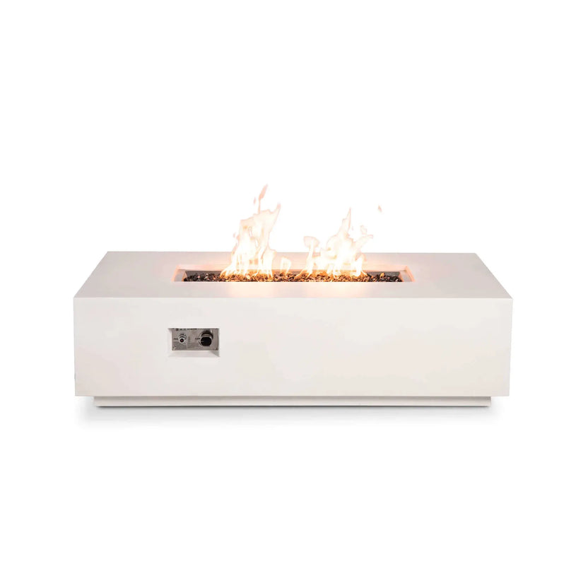 Straight-on view of the Flame Havens Refuge Series 56 x 30 x 15 inch rectangle natural gas white GFRC concrete fire pit with the recessed CSA ignition control panel visible on the front. Bright flames rise above reflective tempered black fire glass, combining convenient flame adjustment with a clean, modern GFRC concrete design.