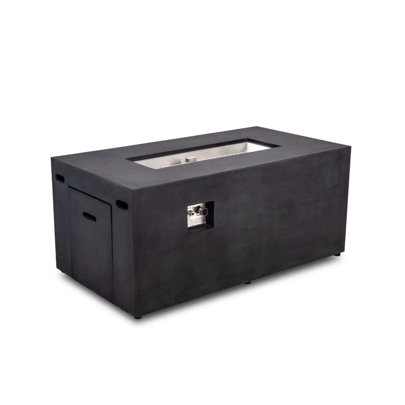 Angled full view of the black Flame Havens Refuge Series 56 x 30 x 24-inch rectangular GFRC concrete propane fire pit, featuring a recessed stainless steel burner pan, CSA ignition controls, hidden tank drawer, ventilation openings, and clean modern profile.