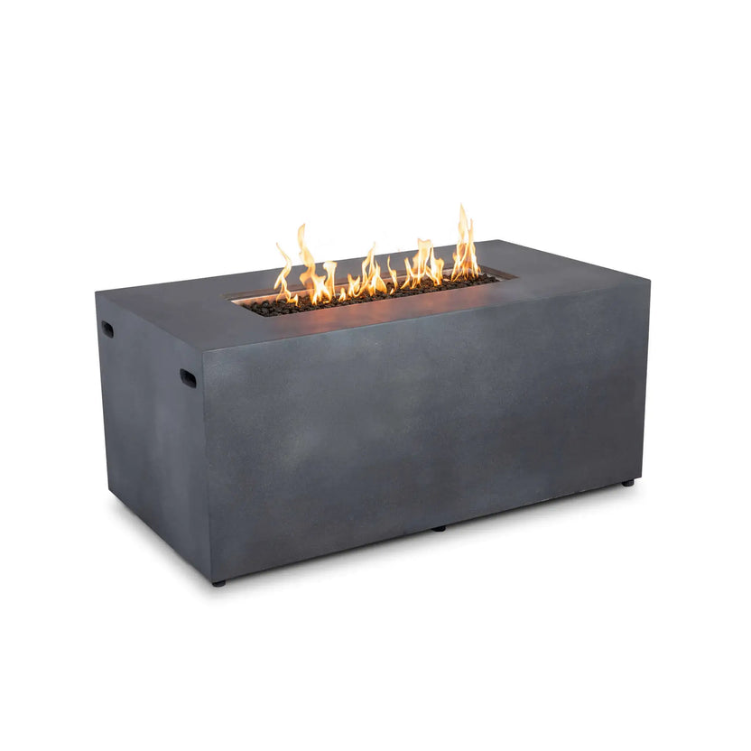 Flame Havens Refuge Series 56 x 30 x 24-inch rectangular propane gas fire pit shown burning against a white background. The gray GFRC concrete body has a clean, control-free front, while a line of yellow-orange flames rises from tempered black fire glass inside the recessed stainless steel burner pan.
