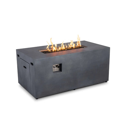Angled view of the Flame Havens Refuge Series 56 x 30 x 24-inch rectangular propane gas fire pit in gray GFRC concrete. Yellow-orange flames burn across tempered black fire glass inside the recessed burner pan, while the front ignition and flame controls, hidden tank drawer and side ventilation openings remain visible against a white background.