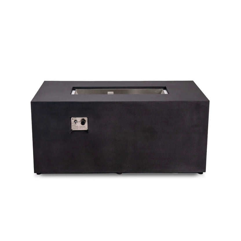 Straight front view of the black Flame Havens Refuge Series 56 x 30 x 24-inch rectangular GFRC concrete propane fire pit. The image shows its recessed stainless steel burner pan, protective ignition cage, broad tabletop ledge, adjustable feet, and front-mounted CSA ignition controls.