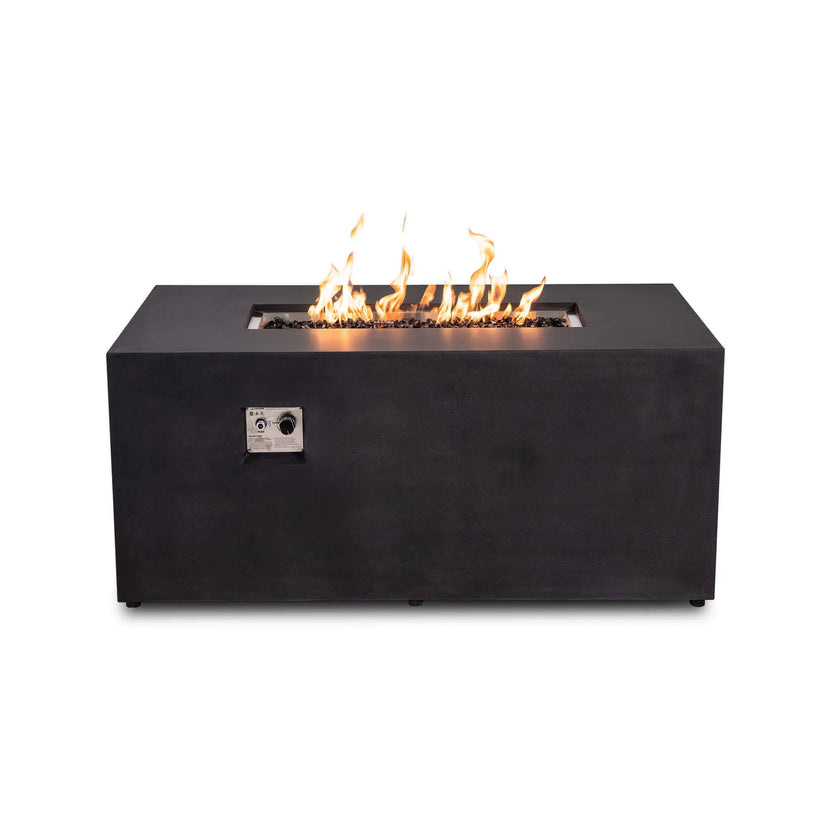 Straight front view of the black Flame Havens Refuge Series 56 x 30 x 24-inch rectangular GFRC propane fire pit with flames burning over tempered black fire glass. The recessed front control panel displays the push-button ignition and adjustable flame control knob.