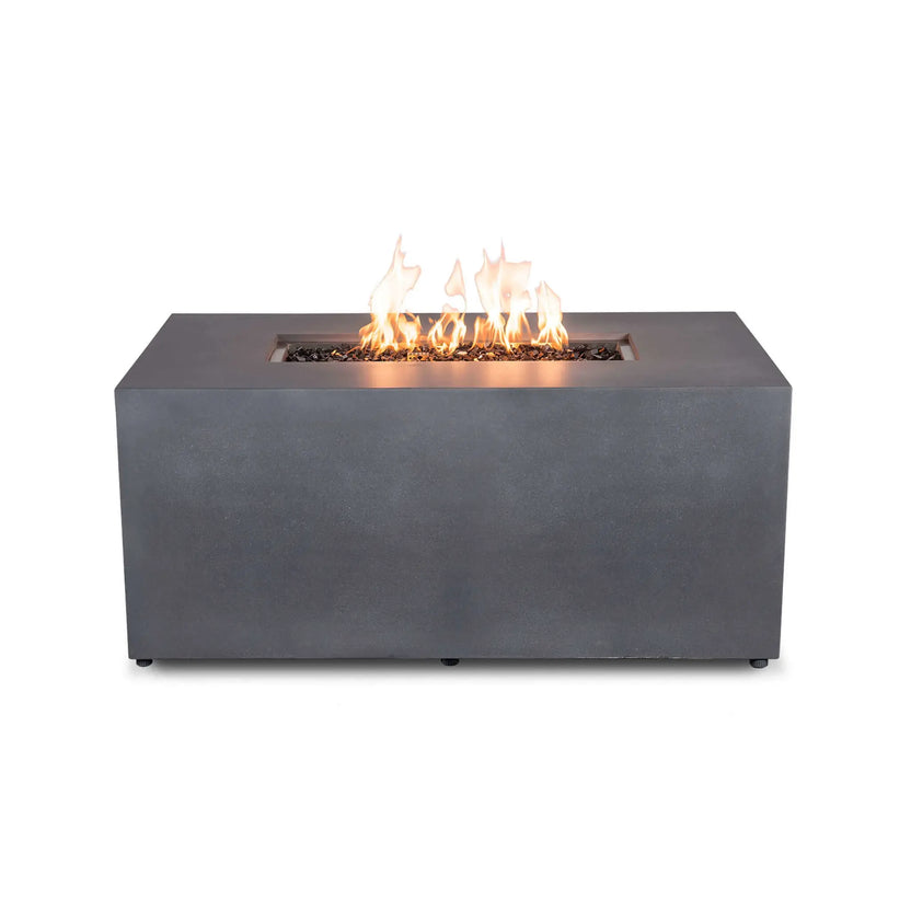 Straight front view of the Flame Havens Refuge Series 56 x 30 x 24-inch gray rectangular propane fire pit burning against a white background. A line of warm yellow-orange flames rises from tempered black fire glass inside the recessed burner, while the simple GFRC concrete face remains free of visible controls.