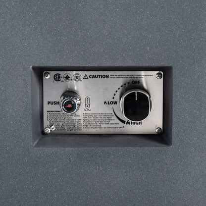 Close-up of the recessed stainless steel control panel on the Flame Havens Refuge Series 68 x 30 x 15-inch natural gas fire pit. The CSA-certified ignition system includes a push-button spark ignitor, AAA battery marking, lighting instructions, caution text, and a large flame-control knob labeled OFF, LOW, and HIGH.