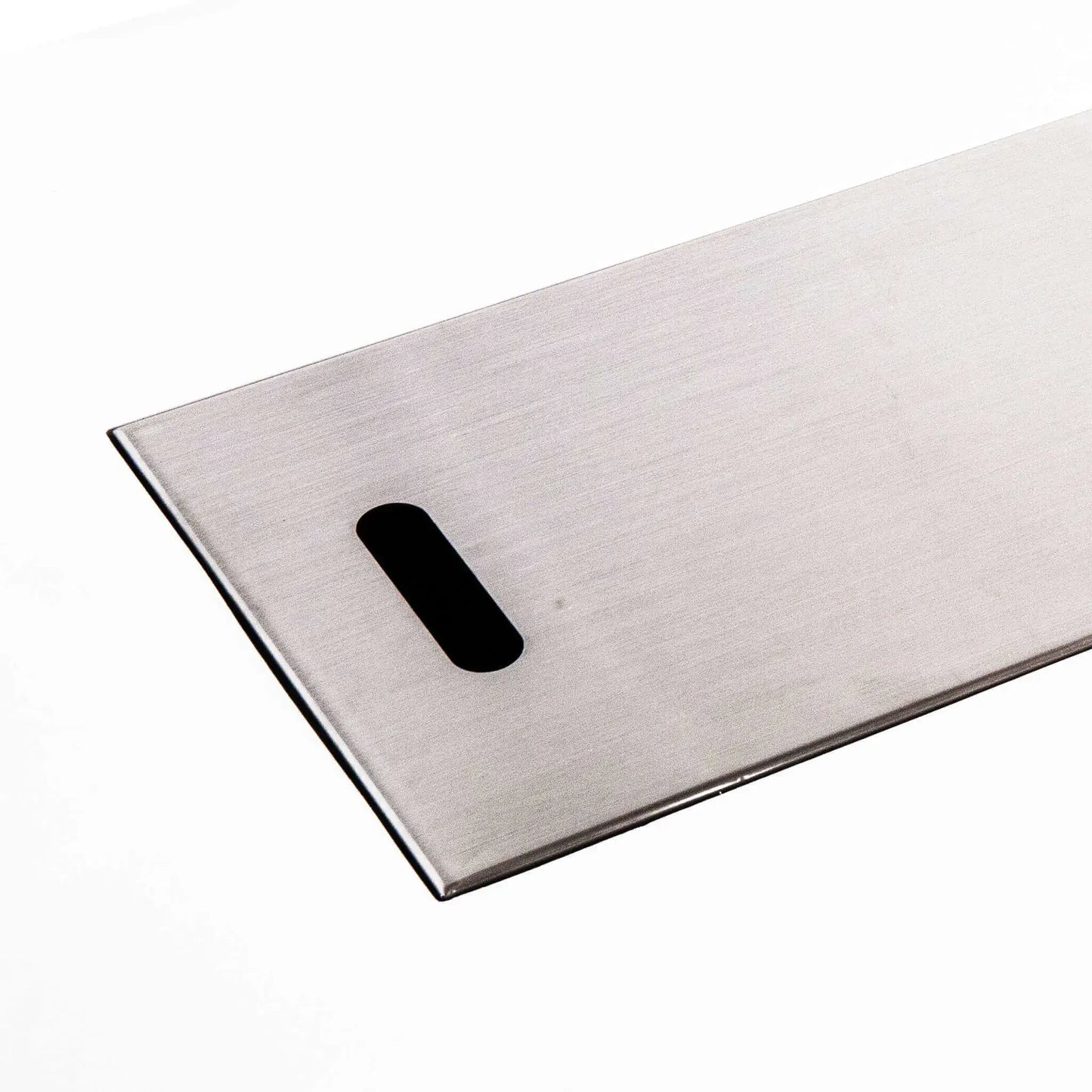 Close-up of the brushed stainless steel burner cover for the Flame Havens Refuge Series 68 x 30 x 15-inch white GFRC rectangular natural gas fire pit. The smooth metal panel features a rounded rectangular handle opening, finished edges and a clean, low-profile design against a white background.