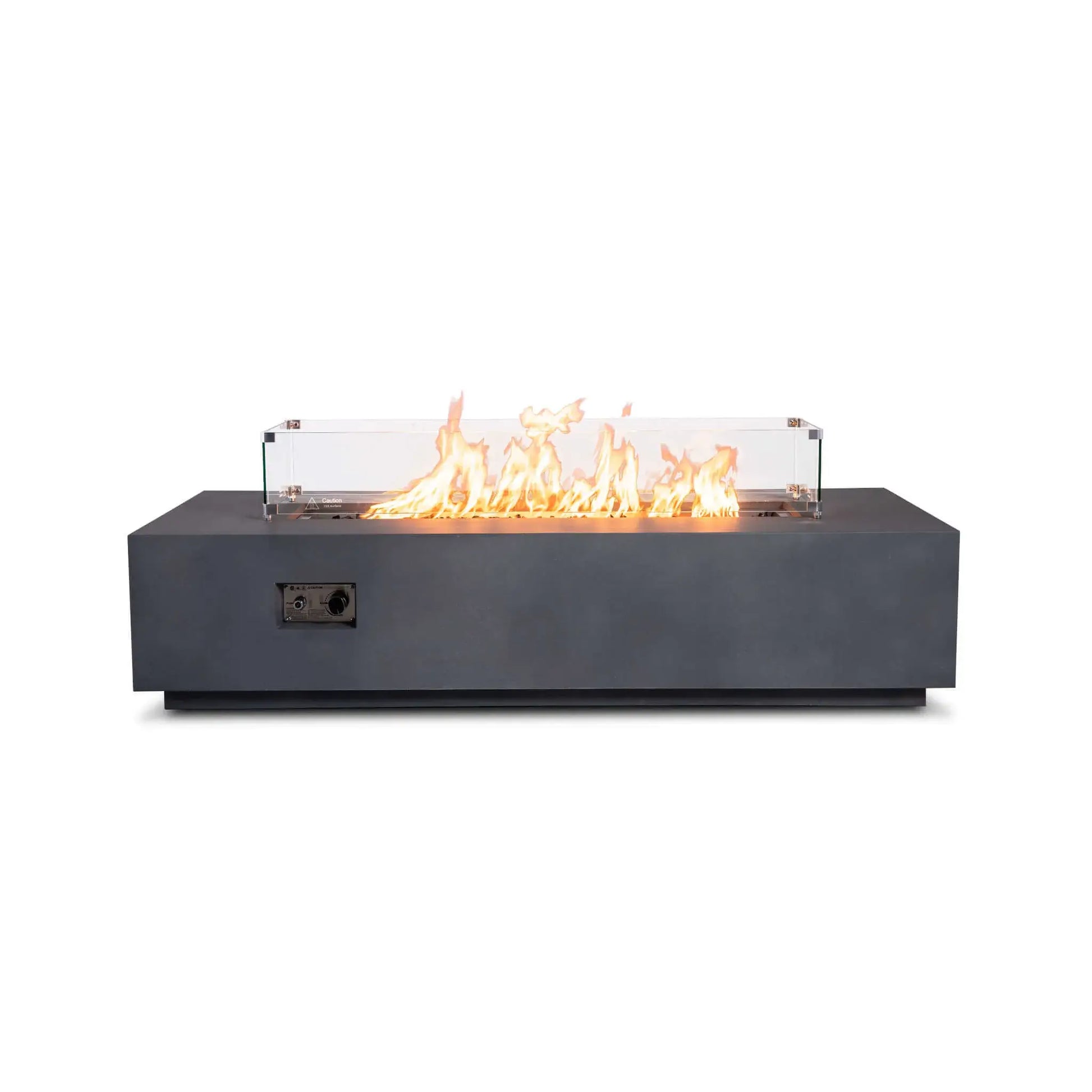 Straight view of the Flame Havens Refuge Series 68 x 30 x 15-inch natural gray GFRC fire pit with a clear tempered glass wind guard. Bright natural gas flames rise over tempered black fire glass, while metal corner brackets secure the wind guard and the recessed front controls remain visible.