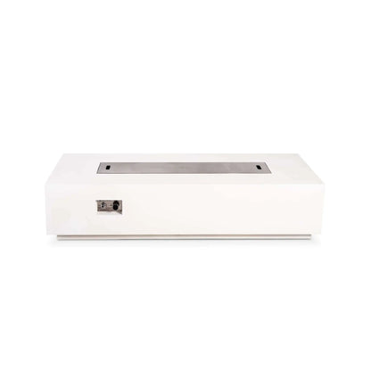 Straight front view of the Flame Havens Refuge Series 68 x 30 x 15-inch rectangular natural gas fire pit in white GFRC concrete. A brushed stainless steel burner cover sits flush across the central opening, while the recessed front panel displays the push-button ignition and gas control knob.