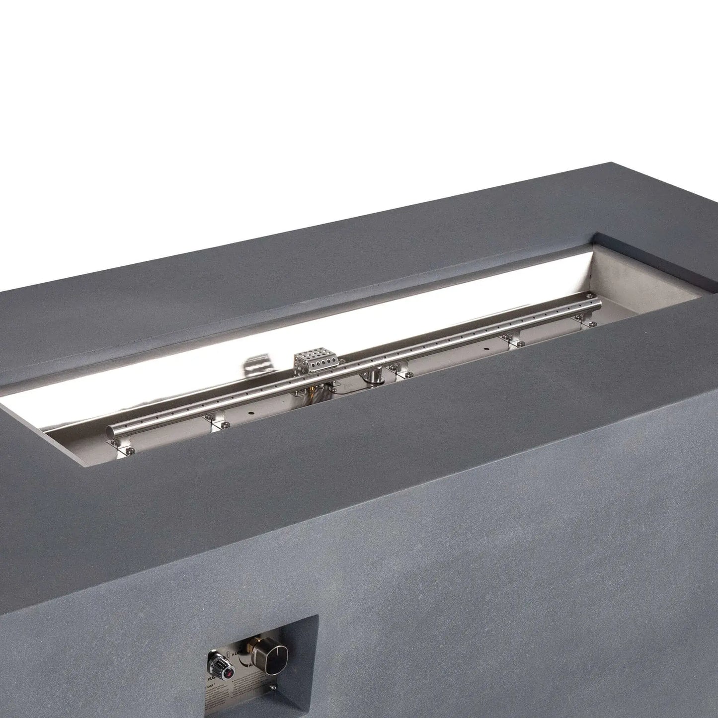 Angled close-up of the Flame Havens Refuge Series 68 x 30 x 24-inch gray propane fire pit, highlighting the polished stainless steel linear burner and pan, perforated ignition cage, mounting hardware, and recessed CSA ignition control panel.