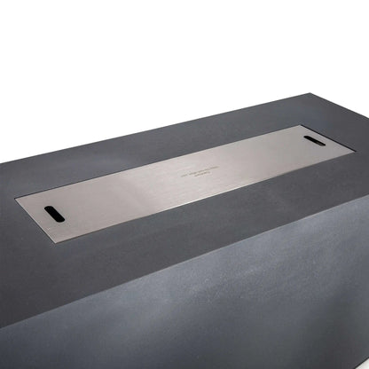 Close-up of the Flame Havens Refuge Series 68 x 30 x 24-inch rectangular gray propane gas fire pit fitted with a flush stainless steel burner cover, featuring two integrated hand openings and a centered caution marking over the concealed fire glass and burner pan.