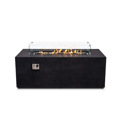 Straight front view of the Flame Havens Refuge Series 68 x 30 x 24-inch rectangular black GFRC concrete propane fire pit with flames burning over tempered black fire glass. A clear tempered glass wind guard with metal corner brackets surrounds the linear burner, while the recessed ignition panel is visible on the front.