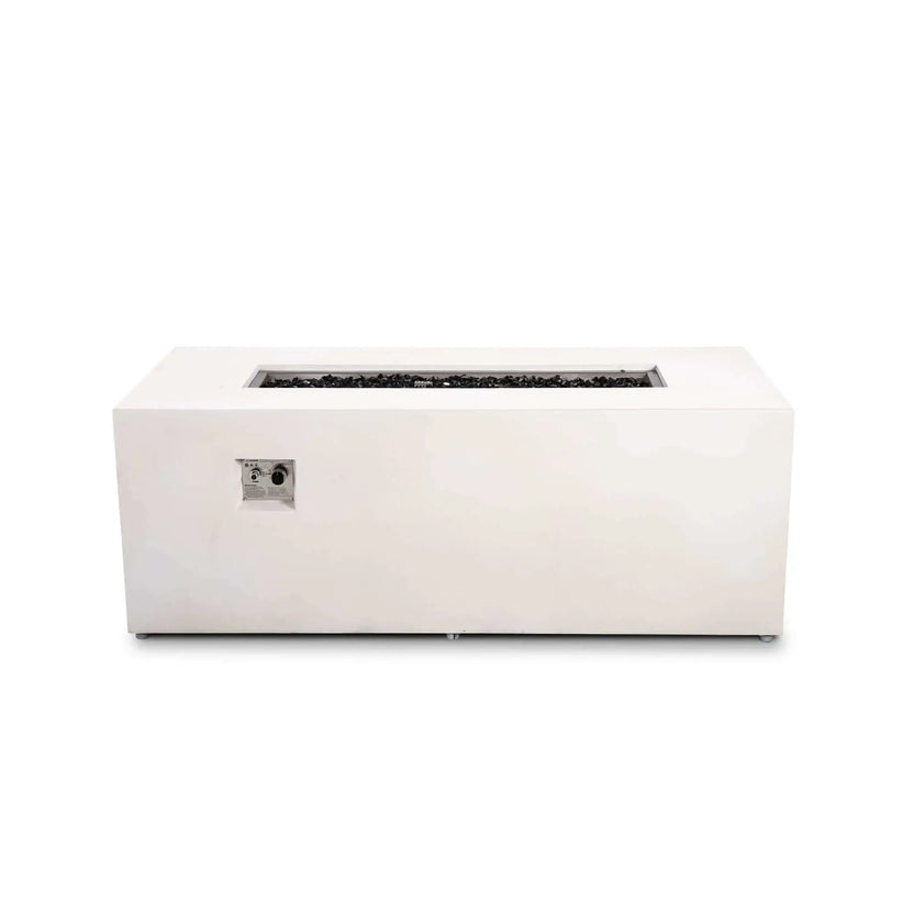 Straight front view of the Flame Havens Refuge Series 68 x 30 x 24-inch white GFRC rectangular propane fire pit with the flame off. Tempered black fire glass fills the long stainless steel burner pan, while the recessed ignition button and flame control knob are visible on the front panel.
