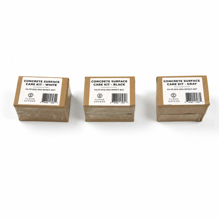 Three packaged Flame Havens Refuge Series concrete surface care kits displayed on a white background. The labeled cardboard boxes show all color-matched options: White on the left, Black in the center, and Gray on the right. Each package includes the Flame Havens logo, product number, and barcode.