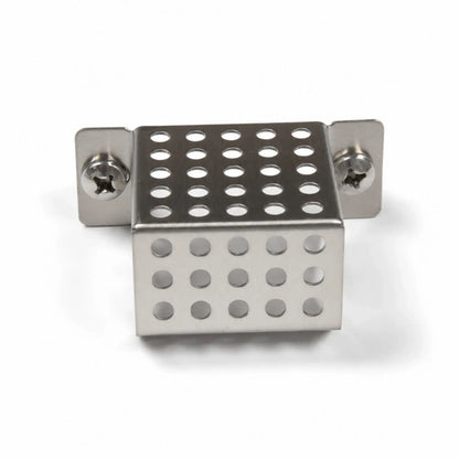 Front view of the Flame Havens Refuge Series ignition shield on a white background. The compact stainless steel fire pit part features a perforated, box-shaped cover with rows of round ventilation holes, folded mounting tabs, and two Phillips-head screws securing the shield assembly.