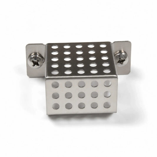 Front view of the Flame Havens Refuge Series ignition shield on a white background. The compact stainless steel fire pit part features a perforated, box-shaped cover with rows of round ventilation holes, folded mounting tabs, and two Phillips-head screws securing the shield assembly.