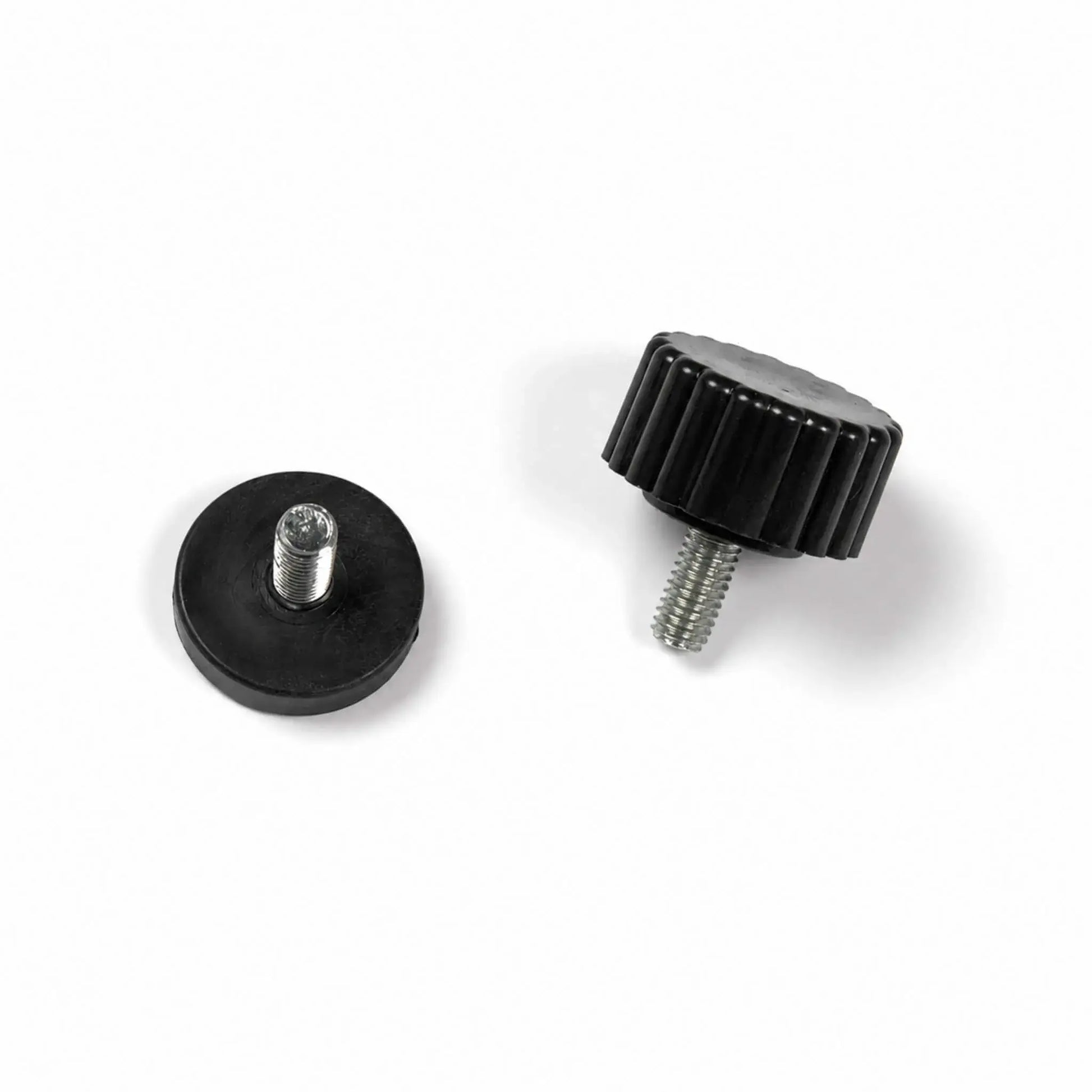 Pair of Flame Havens Refuge Series leveling feet for natural gas and propane gas fire pit models, shown on a white background. Each adjustable replacement foot has a round black base, ribbed edge for easier turning, and a silver threaded metal stem used to stabilize and level the fire pit on uneven outdoor surfaces.