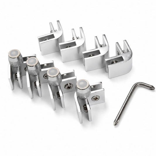 Angled view of the Flame Havens Refuge Series rectangle and square tempered glass wind guard hardware kit. The set includes polished metal corner brackets with protective glass inserts, Phillips screws, four support clamps with knurled adjustment knobs and clear feet, plus an L-shaped assembly tool.