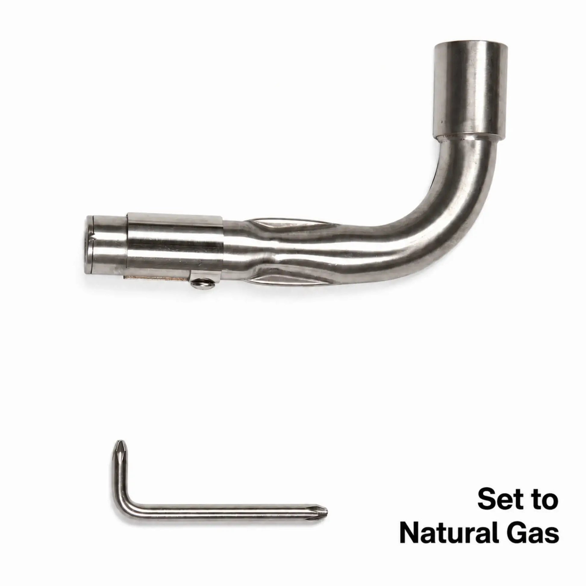 Flame Havens Refuge Series propane and natural gas Venturi pipe shown in the natural gas position. The stainless steel L-shaped pipe has a curved burner connection and an adjustable sleeve covering the air intake screen. An L-shaped adjustment tool appears below, with bold text reading “Set to Natural Gas” in the lower-right corner.
