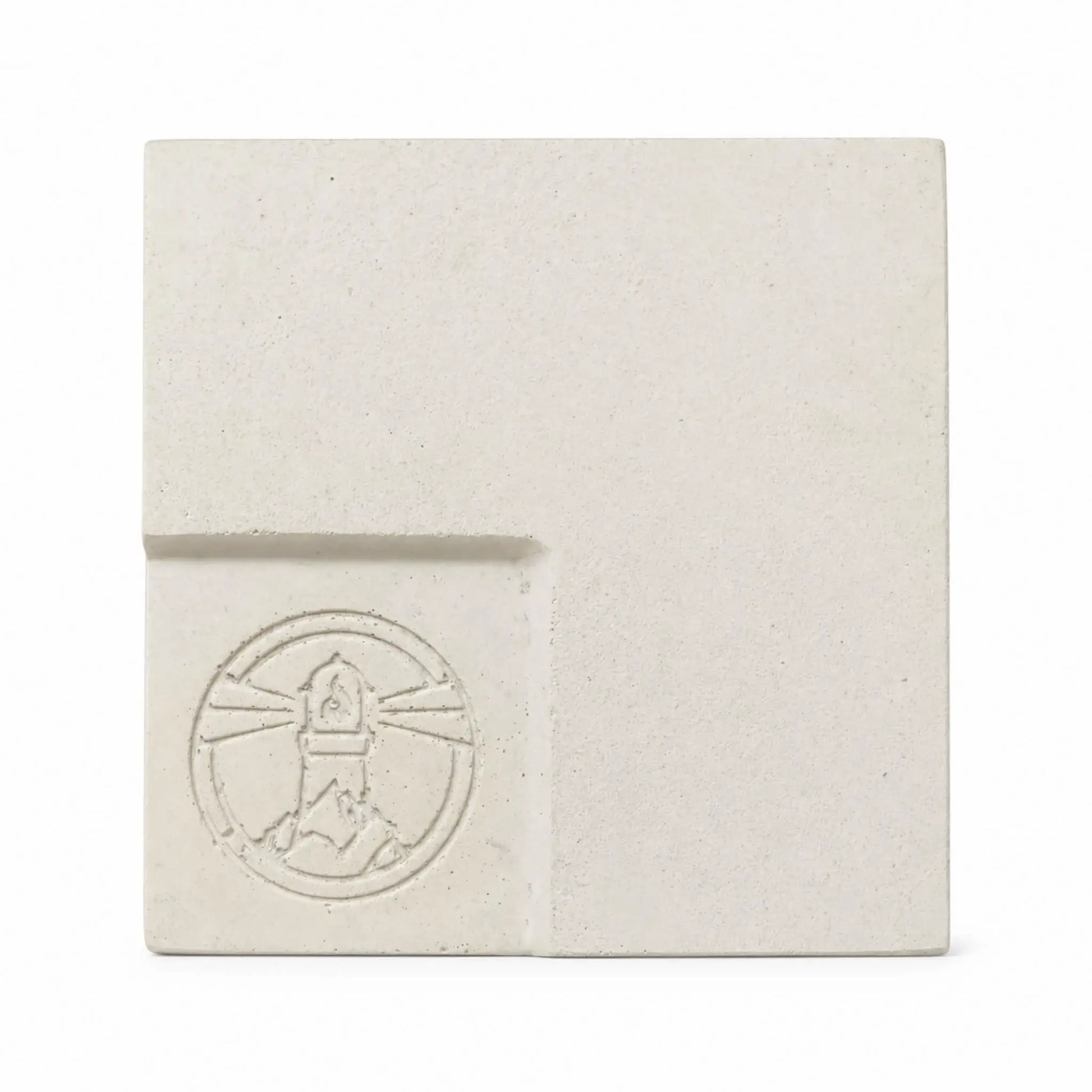 Flame Havens Refuge and Serenity Series GFRC glass fiber reinforced concrete sample in Ivory White. The square finish swatch features a warm off-white tone, natural speckling, subtle surface variation, rounded edges, and a recessed lower-left panel with an embossed Flame Havens emblem.