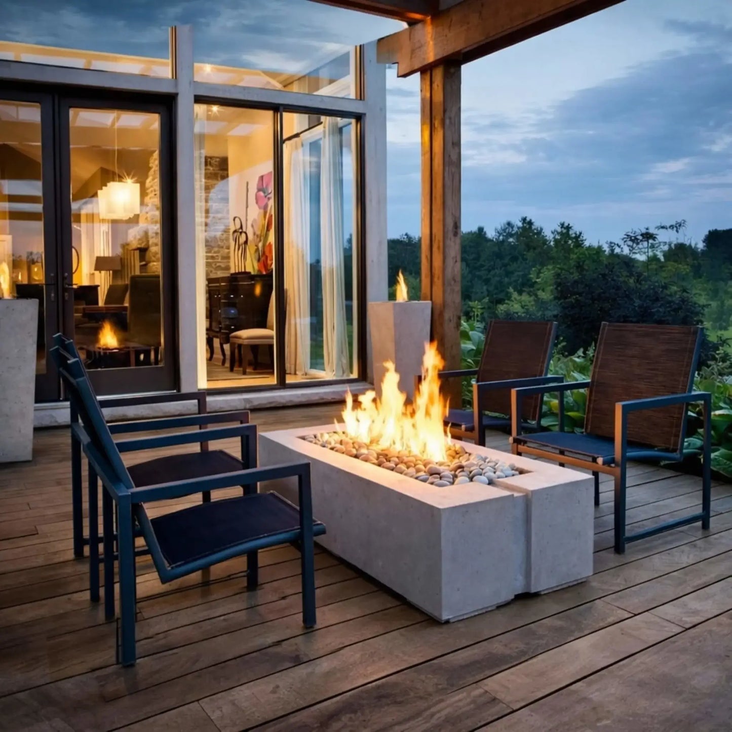 A sleek rooftop or patio lounge featuring a long rectangular fire pit table with a centered linear flame. Surrounded by modern outdoor seating, the clean lines and neutral tones create a sophisticated space for relaxing and entertaining in an urban environment.