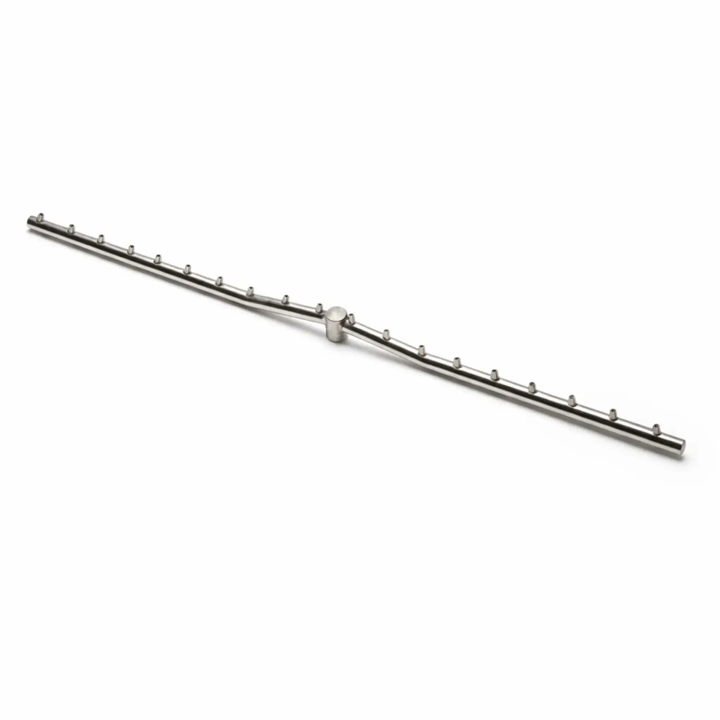 A stainless steel Torpedo T linear burner displayed on a clean white background, showing the T-shaped gas line with evenly spaced burner ports along both sides. The minimalist product shot highlights the precision design and construction of the fire pit burner component.