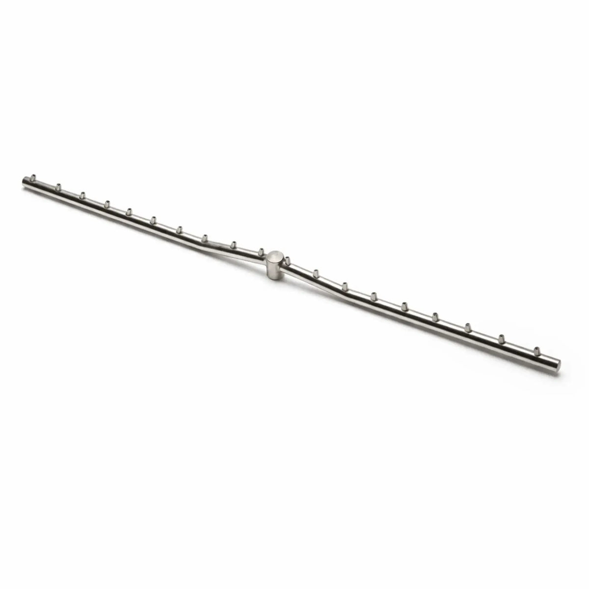 A stainless steel Torpedo T linear burner displayed on a clean white background, showing the T-shaped gas line with evenly spaced burner ports along both sides. The minimalist product shot highlights the precision design and construction of the fire pit burner component.