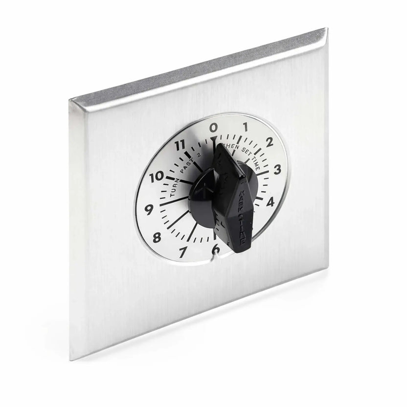 Stainless steel wall-mounted timer control with a black rotary knob and circular dial marked from 0 to 12 hours. The clean, commercial-grade design allows users to set extended run times for fire features, outdoor heaters, or electrical systems requiring reliable timed shutoff functionality.