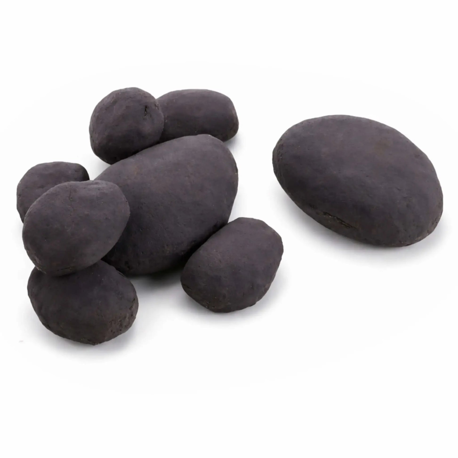 Close-up of smooth black ceramic river rocks in assorted oval sizes arranged on a clean white background. The stones have a matte, natural finish with subtle texture variations, designed to mimic real river rock and ideal for gas fire pits, fireplaces, or decorative landscaping applications.