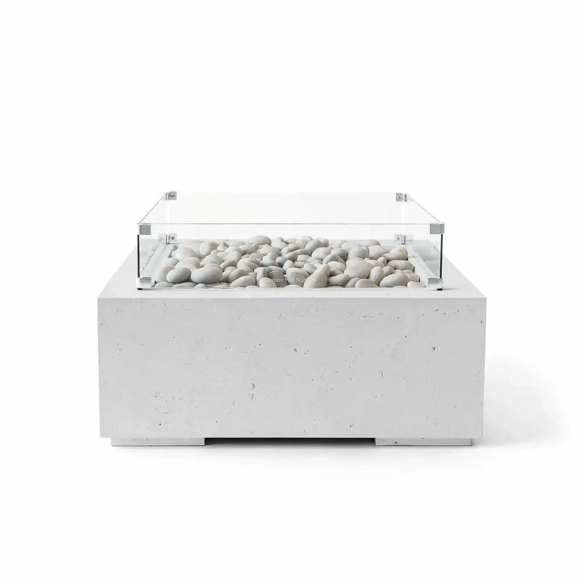 Front-facing product image of the HPC Fire Hearth Products Controls Dekko GFRC Concrete Alea 32 x 32 Fire Pit in Ash finish, featuring a square contemporary fire pit table with a durable GFRC concrete base, decorative ivory fire stones, and a clear tempered glass wind guard surrounding the burner area. Displayed on a clean white background, highlighting the modern outdoor fire feature design and premium construction.