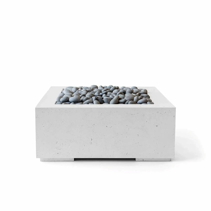 HPC Fire Hearth Products Controls Dekko GFRC Concrete Alea 32 x 32 Fire Pit with Ash finish and polished slate stone fire media. This modern square fire pit combines a sleek concrete appearance with smooth gray stones surrounding the burner area, offering a refined outdoor heating solution for contemporary patios, backyard entertaining spaces, and luxury outdoor living environments.