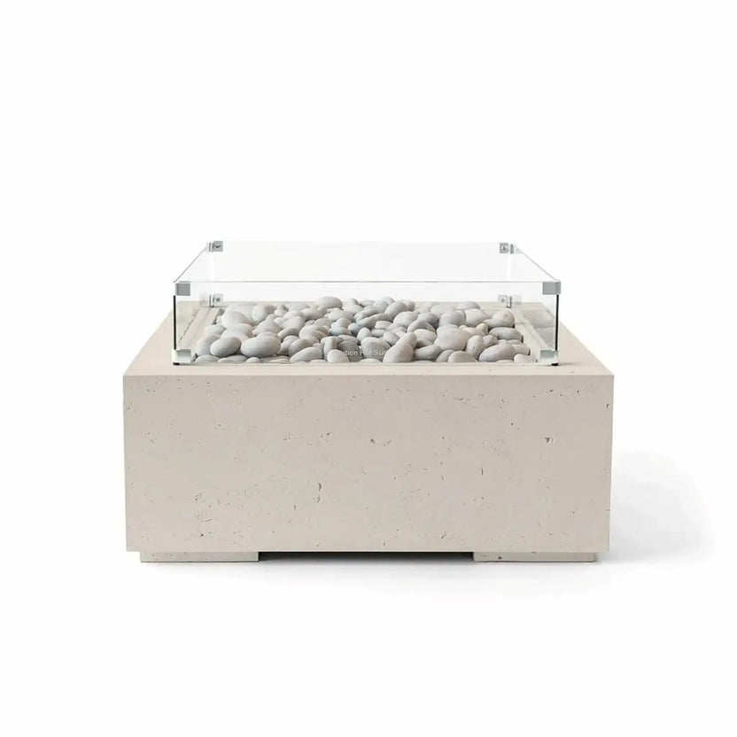 Front view of the HPC Fire Hearth Products Controls Dekko GFRC Concrete Alea 32 x 32 Fire Pit in Clay finish, filled with ivory fire stones and protected by a clear tempered glass wind guard. The warm-toned GFRC concrete body, square profile, and minimalist styling create an elegant outdoor fire feature suitable for patios, decks, and modern landscapes.