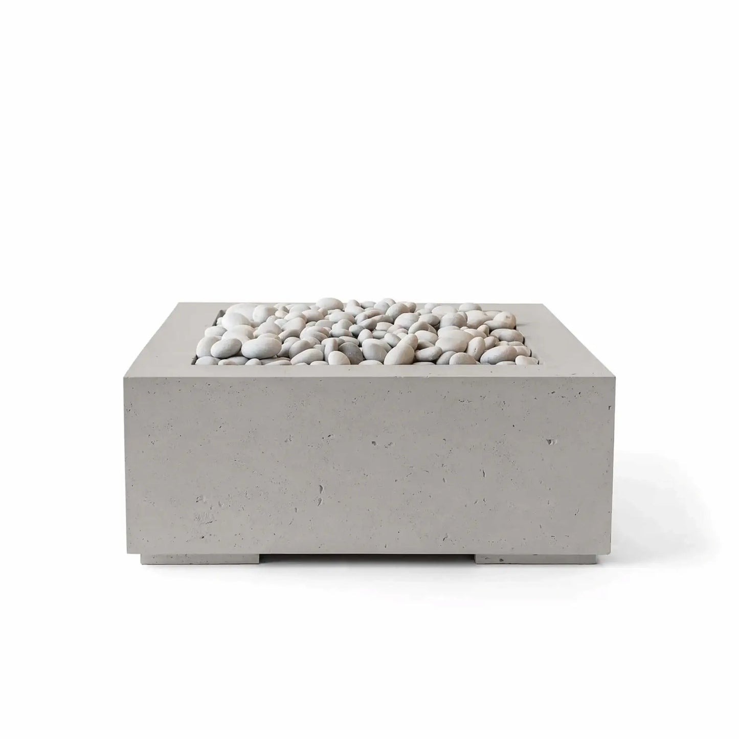 HPC Fire Hearth Products Controls Dekko GFRC Concrete Alea 32 x 32 Fire Pit in Sandstone finish accented with ivory decorative stones. This modern square outdoor fire pit combines a warm sandstone-colored GFRC concrete exterior with smooth white river stones in the burner area. Its clean geometric styling and durable construction make the Alea fire pit an attractive centerpiece for patios, outdoor gathering spaces, resort settings, and upscale backyard environments.